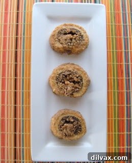 An inviting plate of golden-brown Rugelach cookies, ready to be enjoyed.