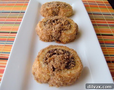 A tempting plate brimming with perfectly baked Rugelach cookies, exquisitely golden and ready for indulgence.