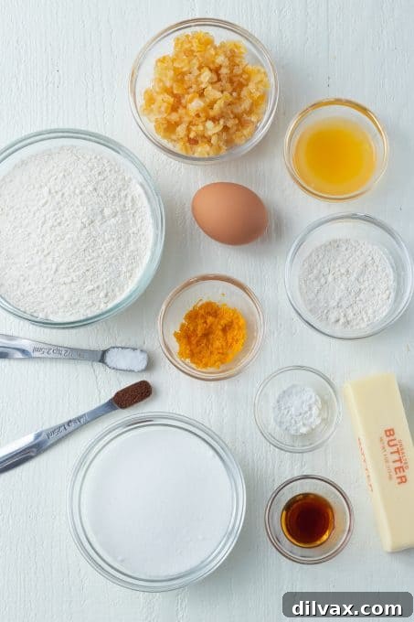 Freshly baked orange sugar cookies cooling on a wire rack