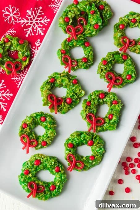 A beautiful plate of vibrant green Christmas Wreath Cookies ready for serving.
