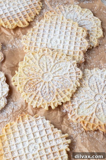 Italian waffle cookies dusted with powdered sugar.
