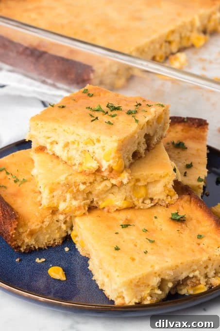 A large serving of spoon bread, emphasizing its moist interior