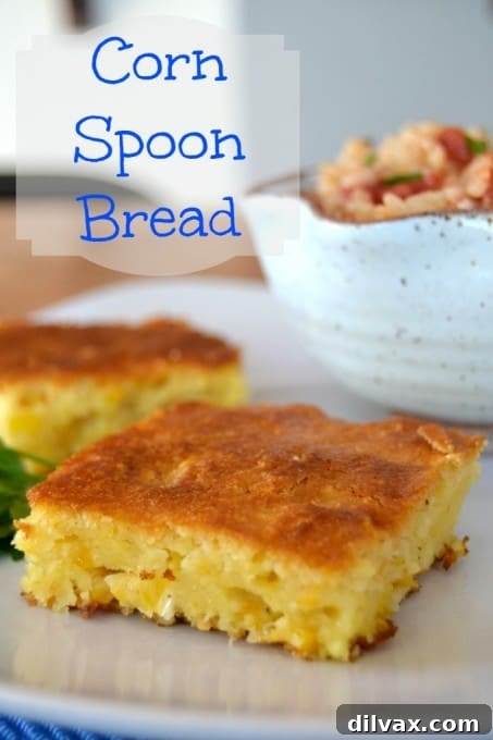 A Southern corn bread casserole, showcasing its soft interior with corn kernels and cornmeal texture.