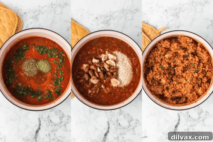 Second stage of Jambalaya cooking process: fluffy rice mixed with chicken, sausage, and vegetables in a Dutch oven after baking.