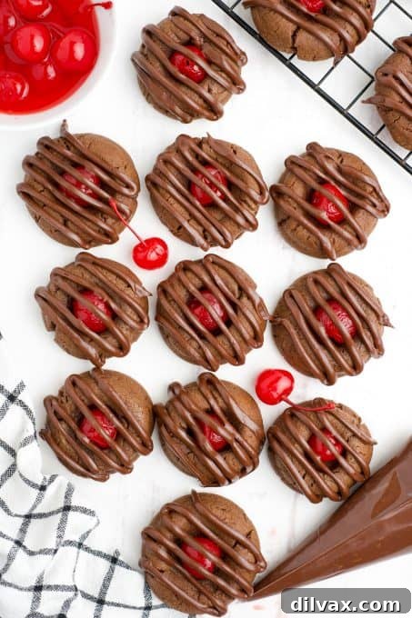 Cherry Kissed Chocolate Cookies 8 A tray filled with freshly baked chocolate cherry cookies, ready to be enjoyed.