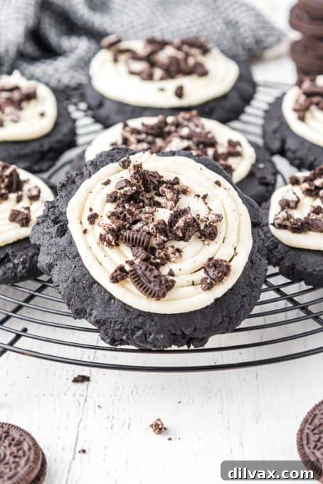 Frosted Oreo Cookies on a cooling rack, freshly baked.