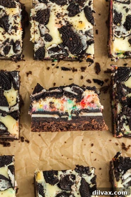 A cheesecake bar with Oreos and colored sprinkles.
