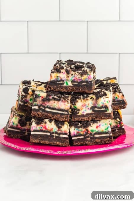 A pate full of Oreo Cheesecake Bars with sprinkles.