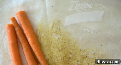 A vibrant bowl of homemade crispy carrot chips, seasoned and ready to eat, suggesting a healthy and delicious snack.