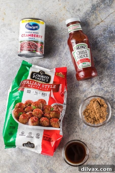 Sweet and Savory Cranberry Meatballs 4 A selection of ingredients laid out for making appetizer meatballs with cranberry sauce, including frozen meatballs, cranberry sauce, chili sauce, Worcestershire sauce, and brown sugar.