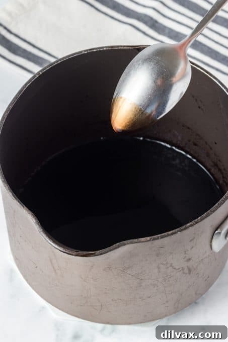 Effortless Balsamic Glaze 7 A homemade balsamic glaze should coat the back of a spoon when it's been adequately reduced, showing its perfect syrupy texture.