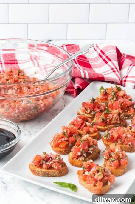 Effortless Fresh Tomato Bruschetta 7 Toasted bread slices topped with chopped tomatoes, garlic, onion, and fresh basil, ready to serve.