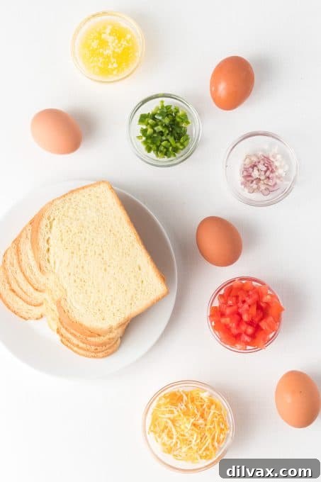 Fresh ingredients for Baked Eggs in Toast Cups laid out on a counter