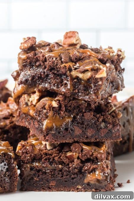 Overhead view of a tray of Turtle Gooey Bars, cut into squares.
