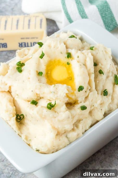 Close-up of fluffy Ranch Mashed Potatoes garnished with fresh chives