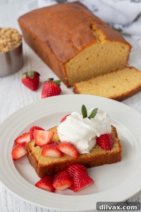 Butterscotch Pound Cake 3 Brown Sugar Pound Cake beautifully garnished with fresh strawberries and a dollop of whipped cream.