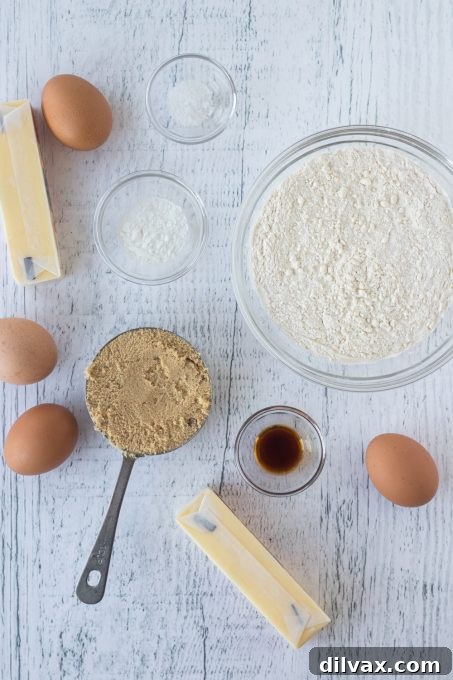 Butterscotch Pound Cake 4 Fresh ingredients laid out for making a delicious brown sugar pound cake, including butter, eggs, flour, and brown sugar.