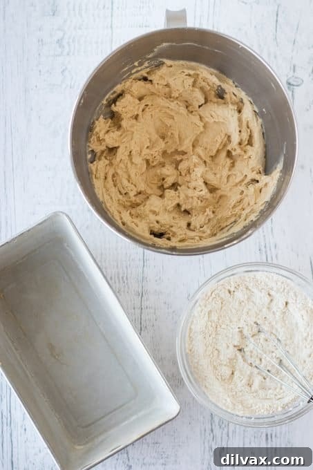 Butterscotch Pound Cake 5 Thick brown sugar pound cake batter poured into a loaf pan, ready for baking.