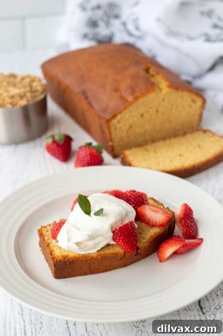 Butterscotch Pound Cake 8 A beautifully presented slice of Brown Sugar Pound Cake on a white plate, ready to be enjoyed.