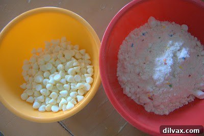 White Chocolate Cake Batter Bliss Bites 2 Joyful baker standing in a kitchen, symbolizing the excitement of reaching a milestone in a long-term project.