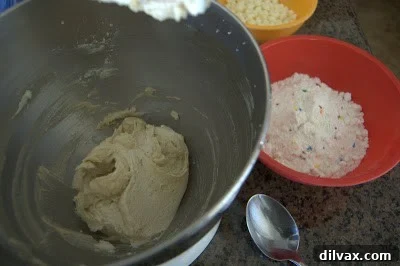 Creaming butter and sugars in a mixing bowl until light and fluffy.