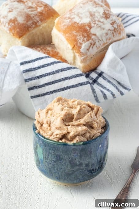 Signature Texas Roadhouse Rolls 8 A bowl of freshly made Easy Cinnamon Honey Butter, ready to be served