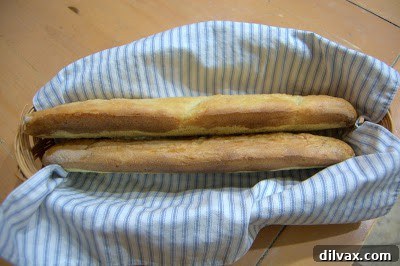 French Bread: A Baker's Journey 13 A collection of the homemade French bread loaves, ready for cooling or serving.