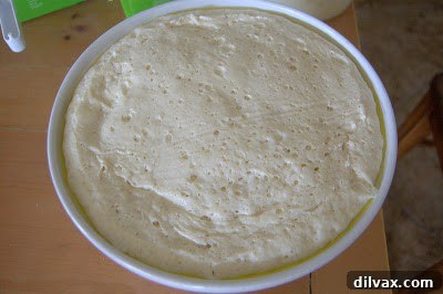 French Bread: A Baker's Journey 6 A detailed view of the surface of one of the homemade French bread loaves, showing its texture.