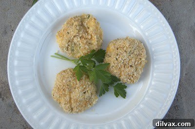 Freshly baked cheesy potato bites cooling on a wire rack, ready to be enjoyed as comfort food.
