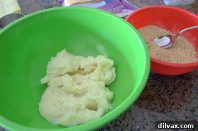 Ingredients laid out for cheesy potato bites, including mashed potatoes, cheese, and green onions.