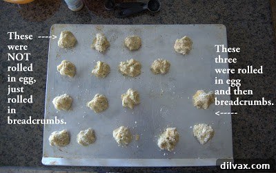 Coating potato bites in breadcrumbs, preparing them for baking.