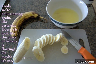 Pile of baked banana chips on a rustic wooden board.