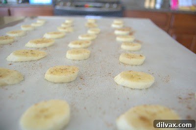 Close-up of baked banana chips, showing their golden color and texture.