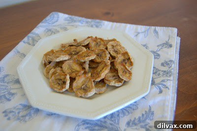 Close-up of golden baked banana chips with a rustic feel.