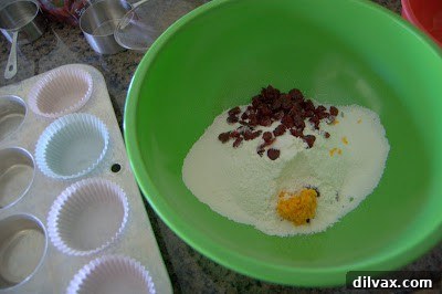 Wet ingredients (egg, milk, orange juice, melted butter) in a bowl.