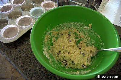 Muffin cups filled with batter.