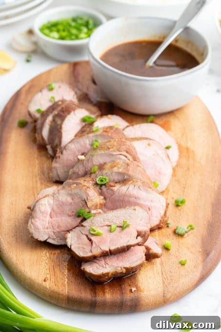 Sticky Asian Glazed Pork Tenderloin 4 Pork tenderloin medallions with an Asian sauce, sliced and ready to serve