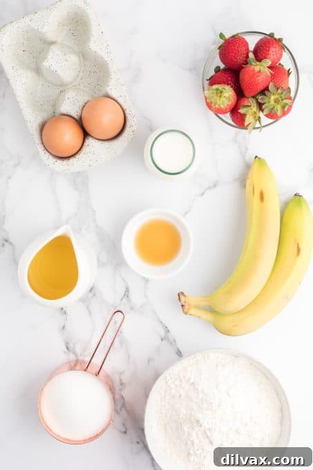 Ingredients for Strawberry Banana Bread laid out on a table