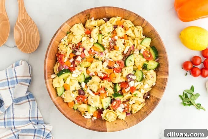 Zesty Greek Tortellini Pasta Salad 2 Vibrant Greek Tortellini Pasta Salad, combining cheesy pasta with fresh vegetables.