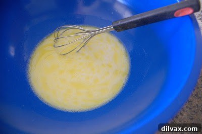 Mixing flour into the wet ingredients for flatbread dough