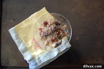 A slightly different angle of the finished baked rice breakfast, highlighting its texture and the visible blueberries and cranberries, ready to be served.