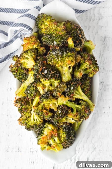 Close-up of roasted broccoli with melted Parmesan cheese and garlic seasoning
