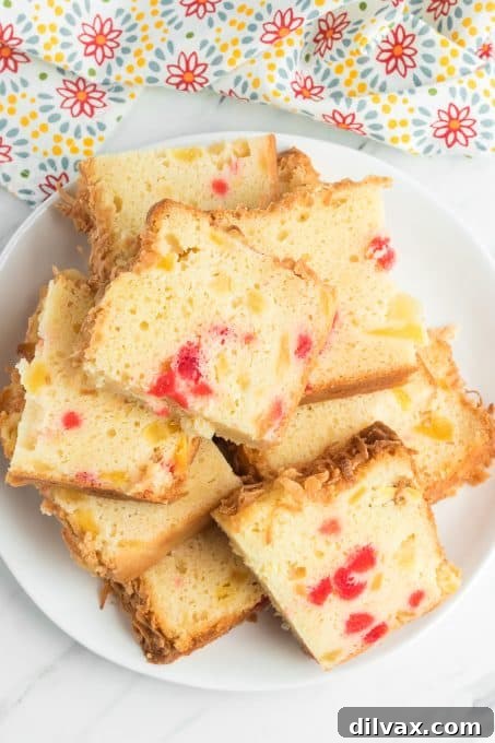 Cherry, coconut and pineapple quick bread on a plate.