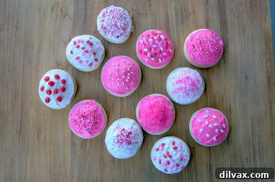 Unfrosted soft sugar cookies cooling on a wire rack, perfectly golden.