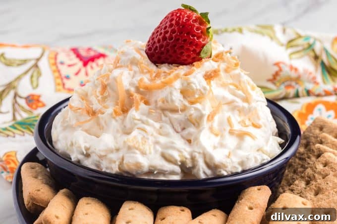 Coconut Pineapple Cloud Dip 2 Pina Colada Dip served in a bowl with fresh fruit dippers