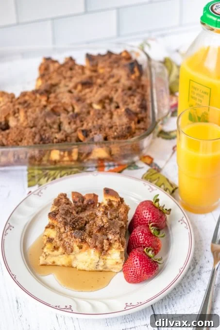 Overnight Cinnamon French Toast Bake 7 A serving of Overnight French Toast with Cinnamon, garnished with powdered sugar and berries.