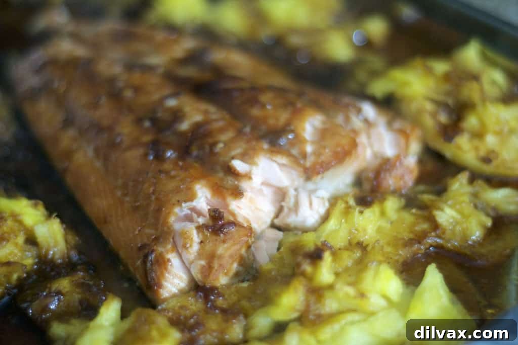 Honey-Glazed Salmon with Caramelized Pineapple 3 Salmon marinated in a brown sugar honey sauce and baked along side some fresh pineapple.