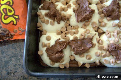 Creating a marbled effect by swirling a knife through the brownie and cream cheese layers.