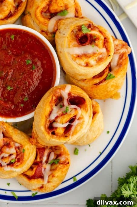 Cheesy Pepperoni Pizza Spirals 3 Close-up of freshly baked pepperoni pizza pinwheels