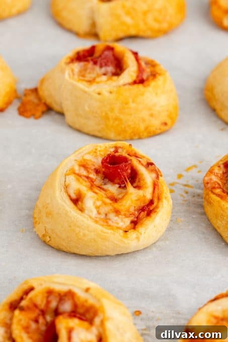 Cheesy Pepperoni Pizza Spirals 8 Freshly baked pepperoni pinwheels golden and ready to serve.